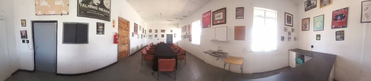 Front-of-house panorama with chairs and notice boards