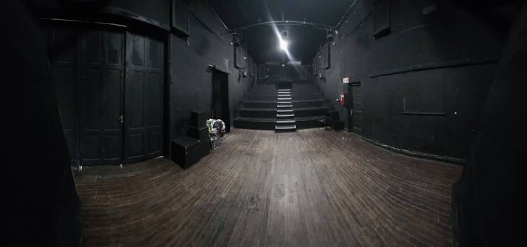 Black Box Theatre with stage floor and audience seating